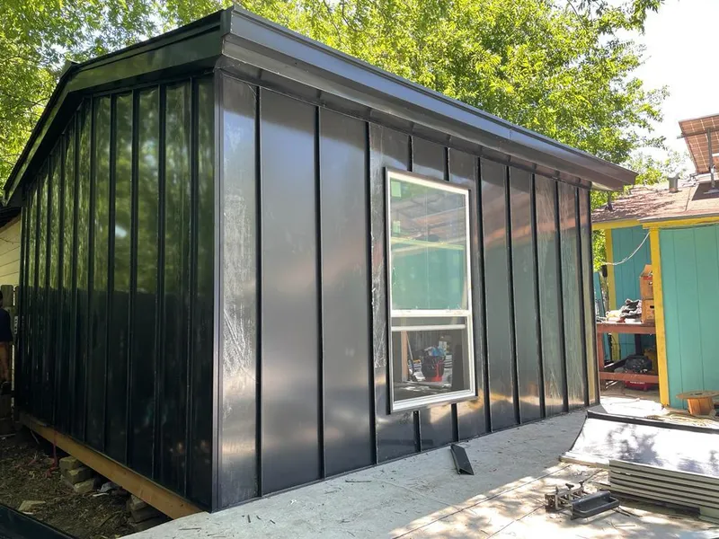 Black standing seam metal wall panels for Roof Inspection in Arnold